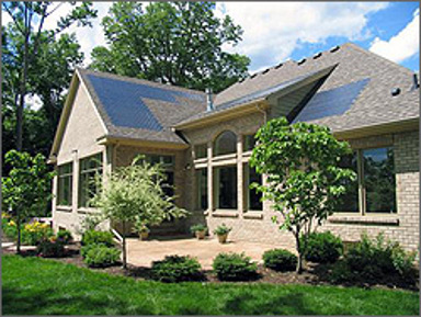 Thin-film solar roof tiles on a house